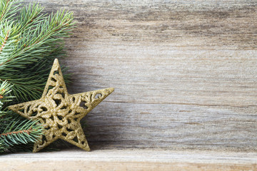 Fototapeta na wymiar Christmas decoration with fir branches on the wood background.