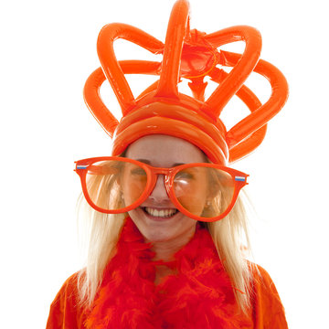Young woman as Dutch orange supporter with crown