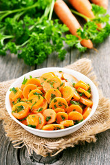 Vegetables salad with carrot and green herbs
