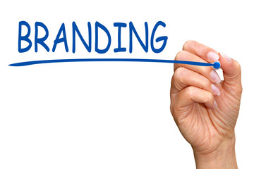 Branding - female hand writing blue text on white background