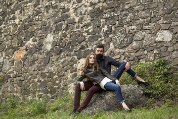 Obraz na płótnie Canvas Couple near stony wall