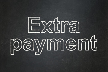 Currency concept: Extra Payment on chalkboard background