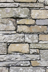 Full frame background or texture of a stone wall constructed from slate in the English Lake District.