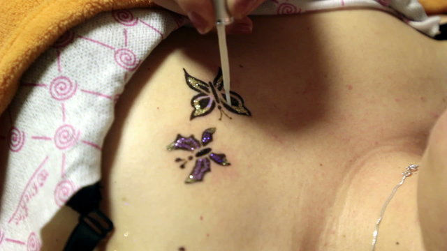 Temporary tattoo, henna tattoo and sequins