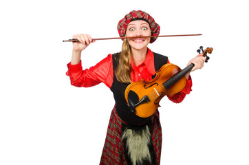 Funny woman in scottish clothing with violin