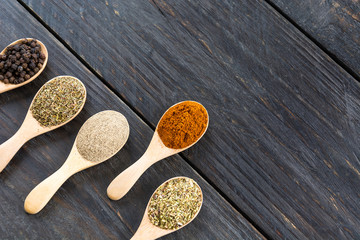 Spices and herbs in  bowls.