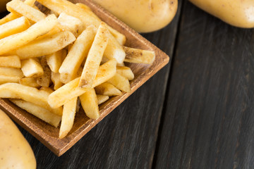 french fries on wood background