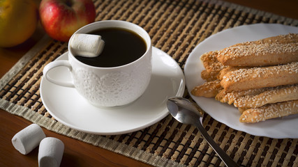 Perfect breakfast: cup of coffee, cheese sticks and fruit