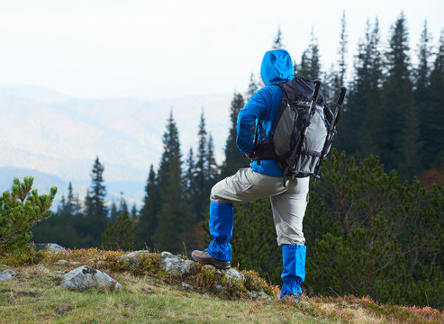 advanture man with backpack hiking