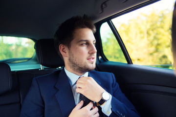 Handsome businessman in the car