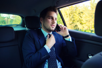 Handsome businessman in the car