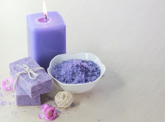 Obraz na płótnie Canvas Spa treatment setting with purple theme