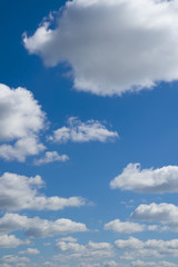 Naklejka premium Big and small clouds, blue sky. Heaven.