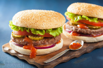 burger with beef patty lettuce onion tomato ketchup