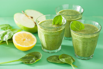 healthy green spinach smoothie with apple lemon