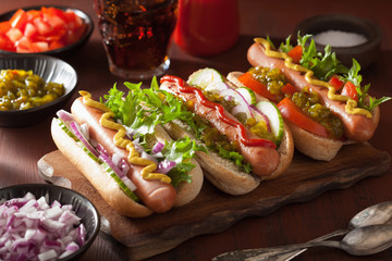 cooking grilled hot dogs with vegetables ketchup mustard