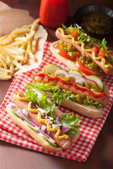 grilled hot dogs with vegetables ketchup mustard