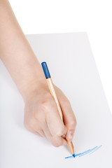 hand draws by wooden blue pencil on sheet of paper