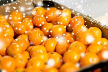 ripe mandarins at food market or farm