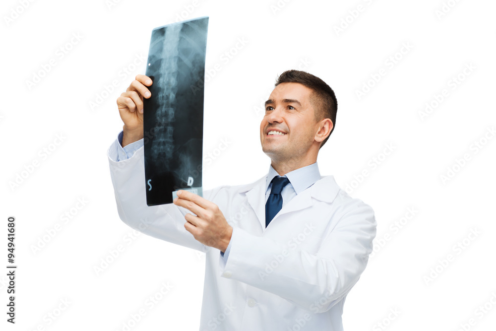 Sticker smiling male doctor in white coat looking at x-ray