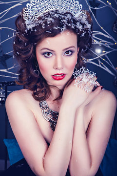 Portrait of young woman as Snow Queen character