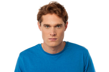 Young serious man staring