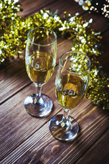 A decorated christmas table with champagne glasses and christmas. Selective focus.