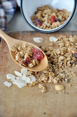 granola and dried berry on spoon