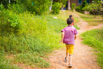 Little boy running in the park