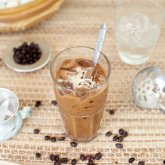 Traditional Vietnamese, Thai Ice coffee with beans on wooden background