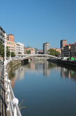 Fototapeta na wymiar River Nervion, Muelle de Martzana Embankment, bridge. Bilbao, Spain