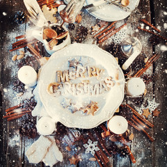 Festive Decor on Wooden Table. Baked Letters Merry Christmas