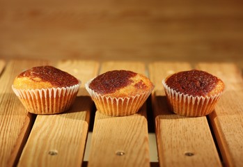 Three muffins in paper cups