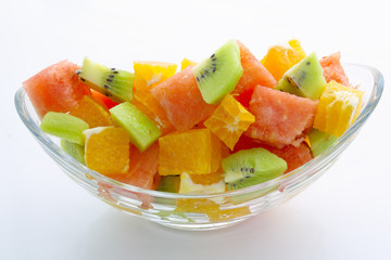 Fresh fruits salad on white background