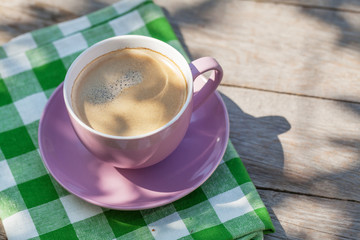 Coffee cup on garden table
