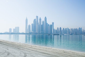 Hazy dubai marina skyline shot from the palm