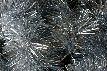 Christmas tinsel silver texture black background