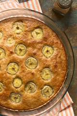 Freshly baked homemade banana and cinnamon cake, photographed overhead with natural light (Selective Focus, Focus on the top of the cake)