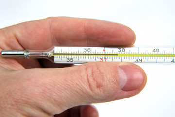hand with medical thermometer close up