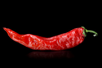 Red hot pepper on a black background