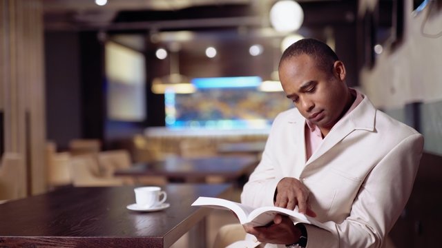 Happy African American College Student With Books