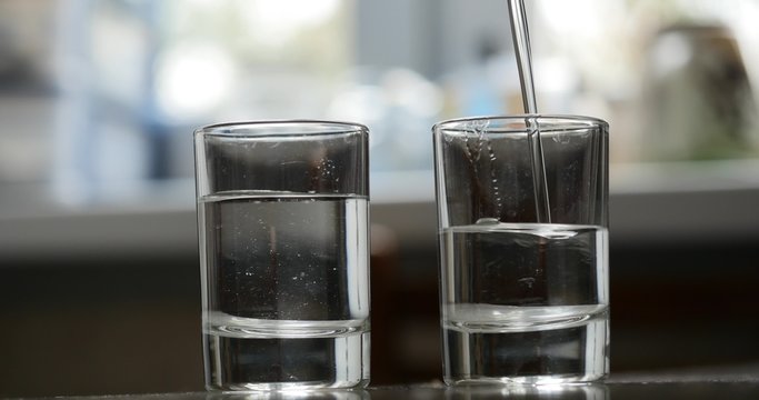 pouring glass with alcohol