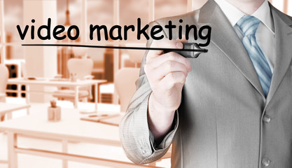 business man writing Video Marketing