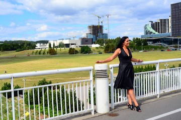 Woman in black on the bridge in Vilnius town