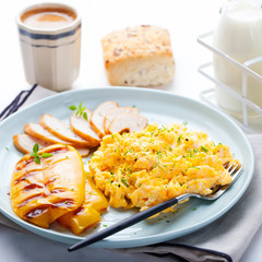Scrambled eggs, omelet, sweet pepper and hot smocked chicken, ham.