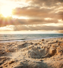 Tropical beach at sunset in Goa, India.