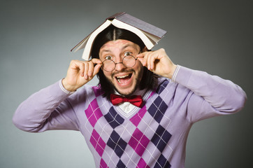 Young student with book in learning concept