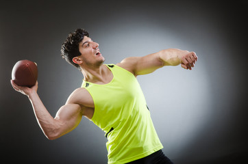 Muscular man with american football