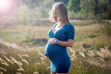 Pregnant woman outdoors