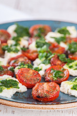 Salad of roasted tomatoes, mozzarella and Basil